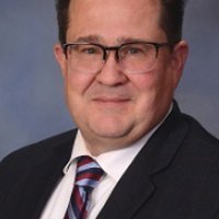 Official portrait of Gregory Koenig